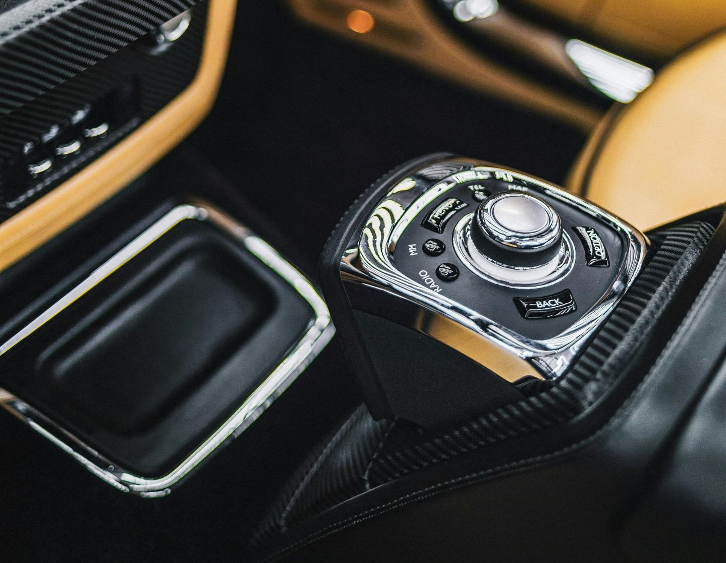 A close up of a steering wheel in a car