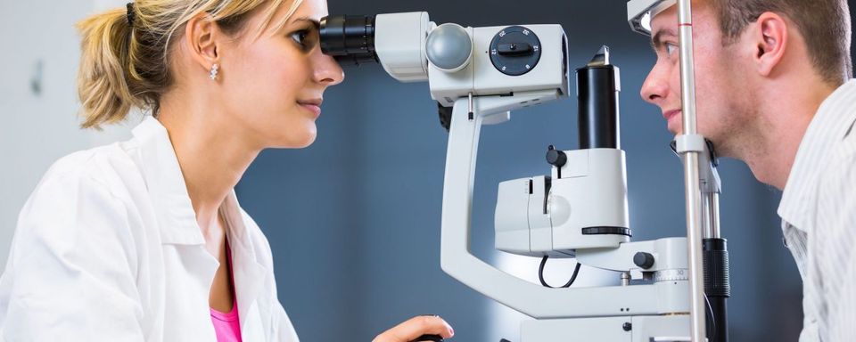 Eye Doctor — Doctor Checking Eye of Patient in Lafayette, IN