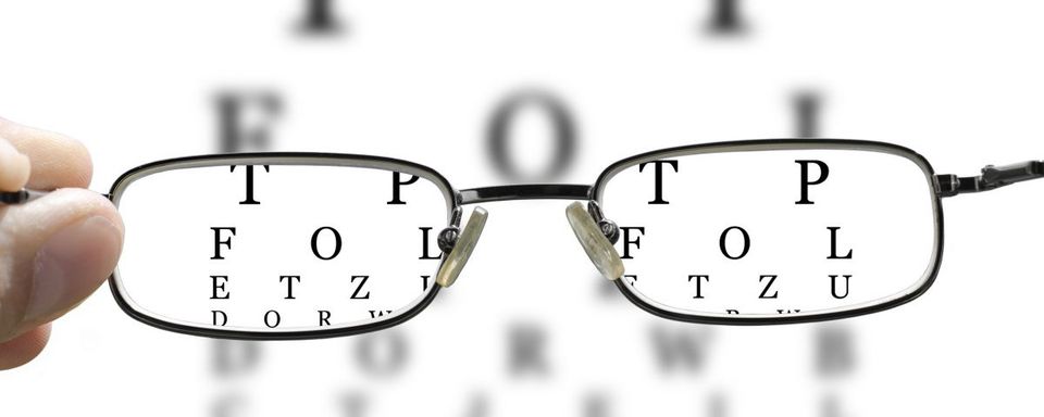 Reading Glasses — Reading Glasses on Snellen Chart in Lafayette, IN