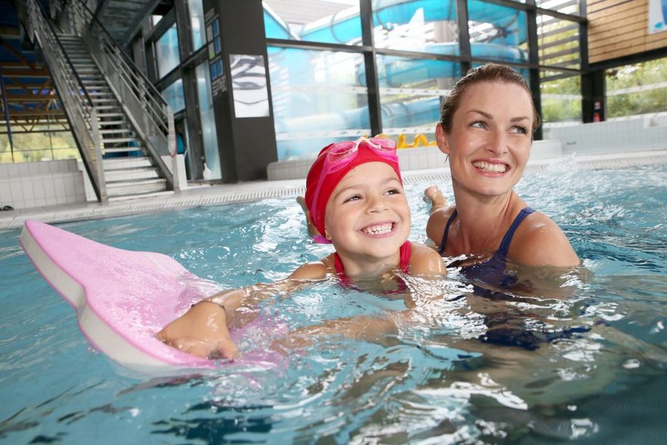 Eye Care Team — Woman Teaching a Kid How to Swim in Pool in Lafayette, IN