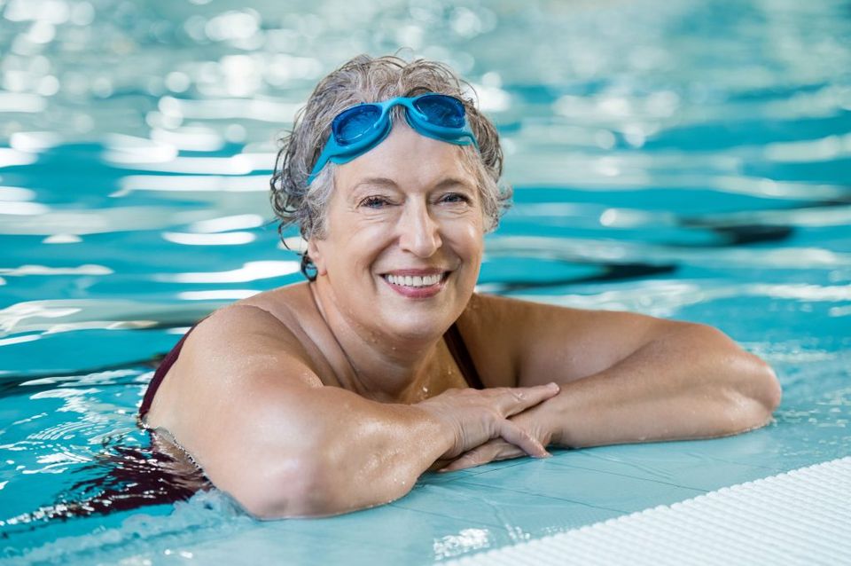 Eye Protection — Old Woman Wearing Swimming Goggles in Pool in Lafayette, IN
