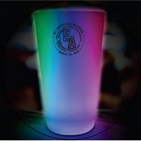 A glow in the dark cup that says ea on it