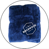 A blue blanket with the word birchwood on it