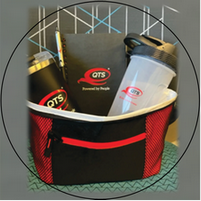 A red and black qts cooler filled with items