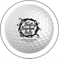 A white golf ball with the words bourbon balls written on it.