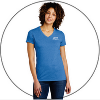 A woman is wearing a blue v-neck t-shirt.