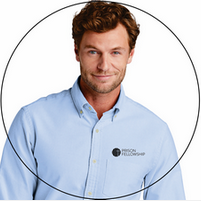 A man wearing a light blue shirt that says prison fellowship