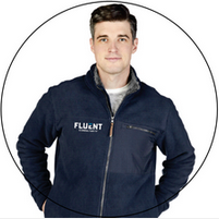 A man wearing a jacket that says fluent on it
