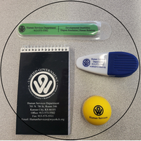 A circle with a notepad a marker and a yellow ball