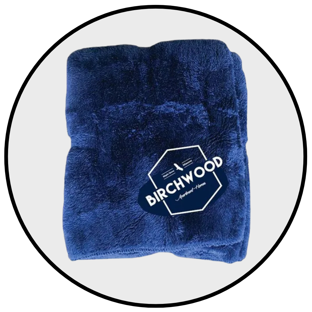 A blue blanket with the word birchwood on it