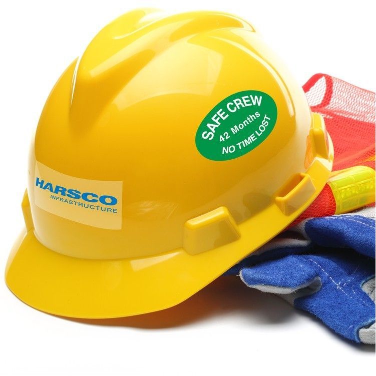A yellow hard hat that says safe crew on it