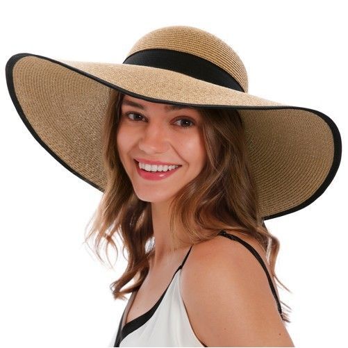 A woman wearing a straw hat with a black band