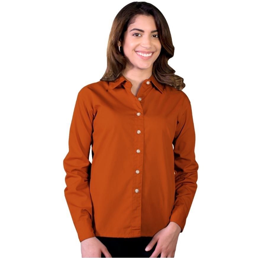 A woman is wearing an orange shirt and smiling