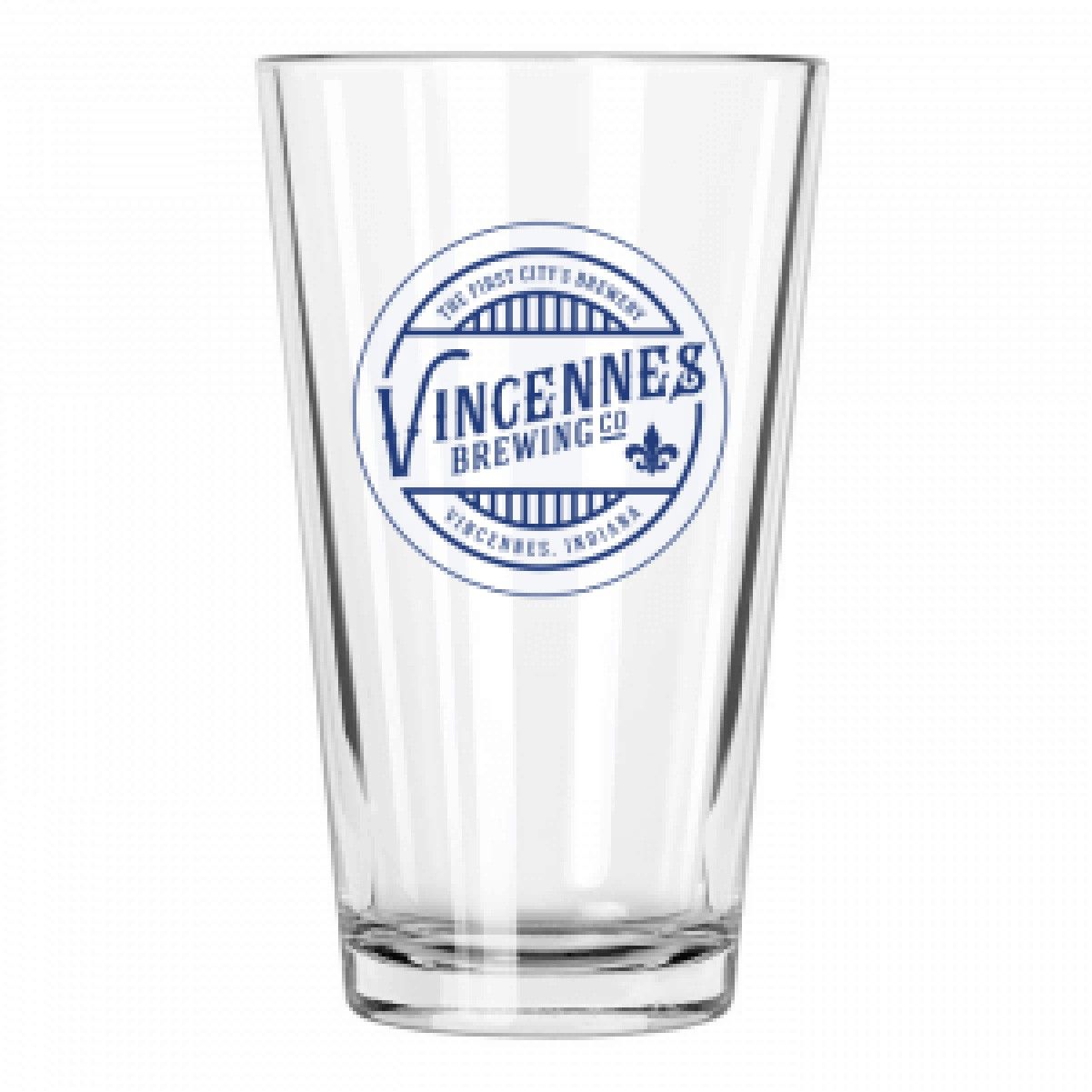 A clear glass with a blue logo on it that says vincentes brewing