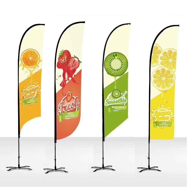 A set of four flags with different fruits on them.