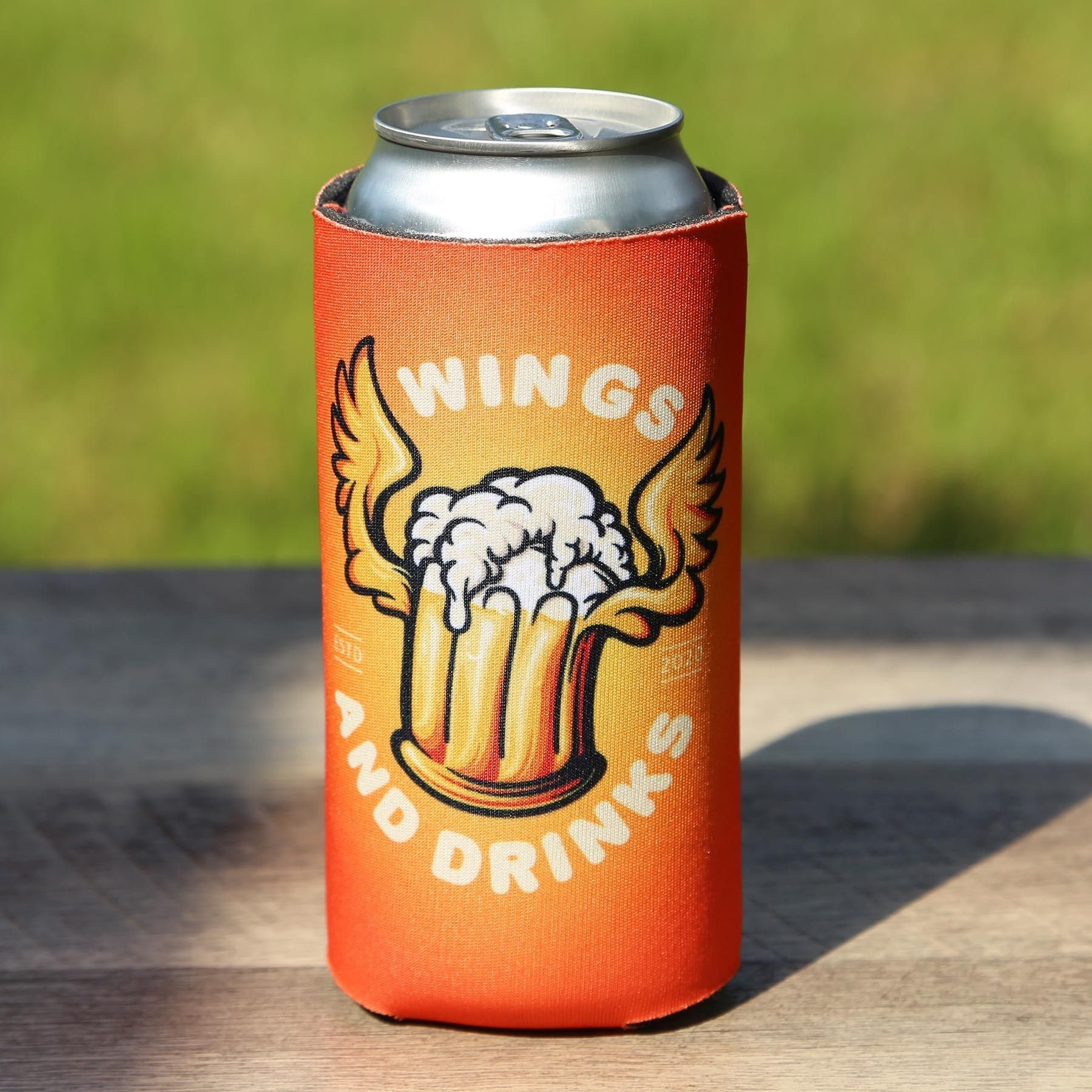 A can of beer with wings and drinks on it