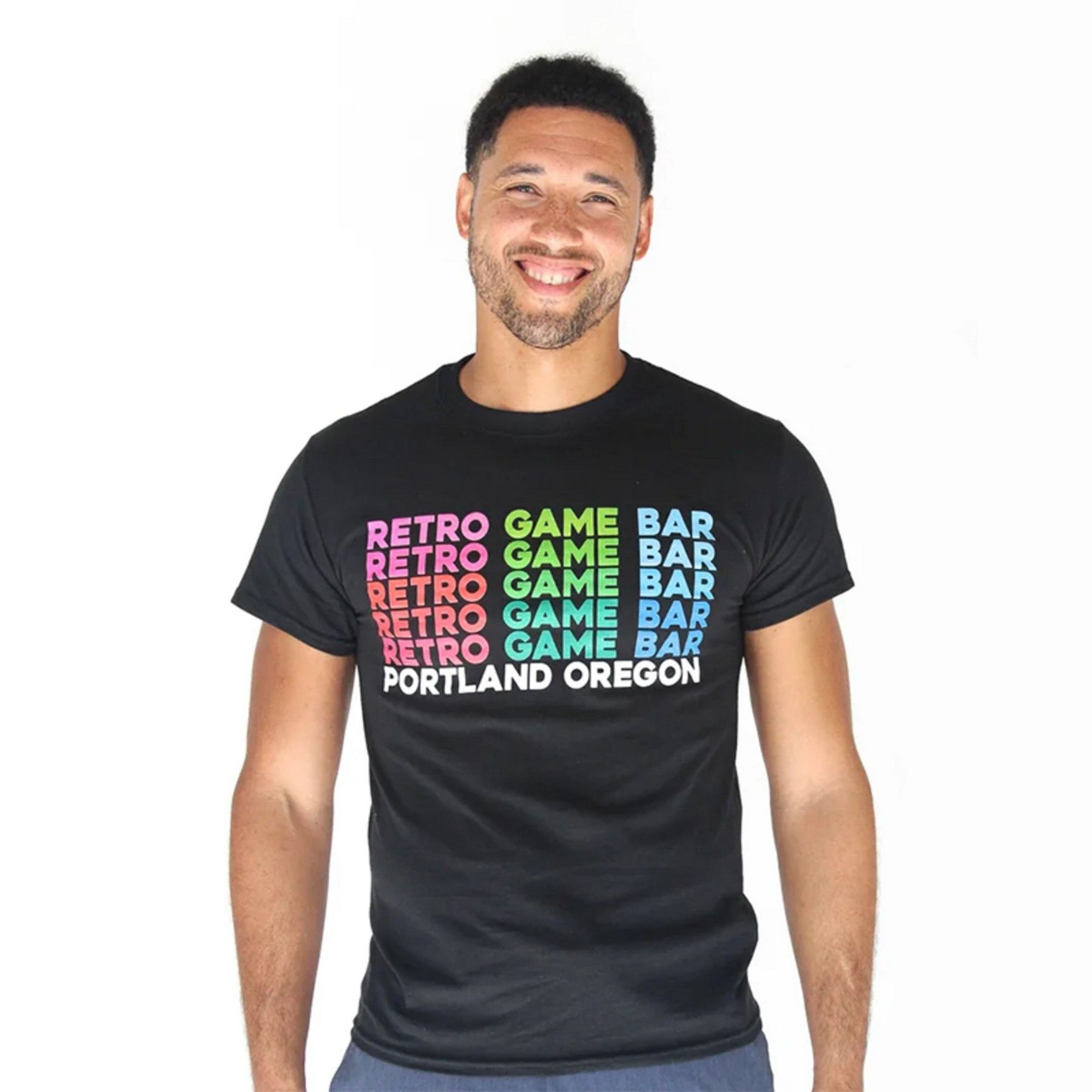 A man wearing a black t-shirt that says retro game bar portland oregon