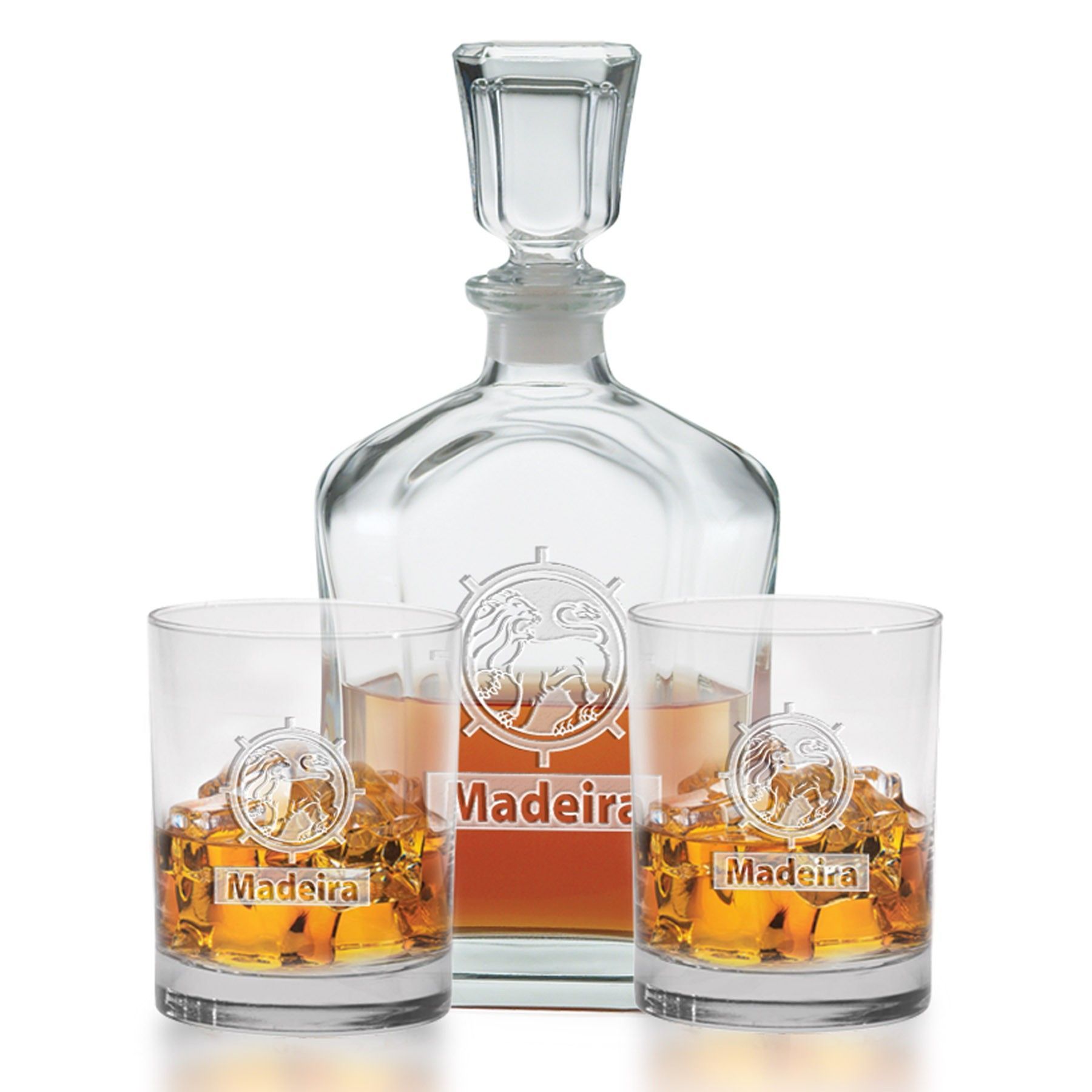 A decanter and two glasses filled with whiskey on ice.