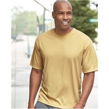 A man is wearing a yellow t-shirt and smiling.