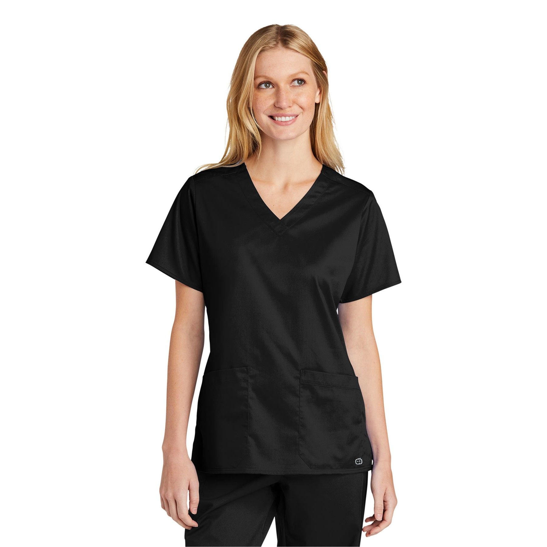 A woman is wearing a black scrub top and black pants.