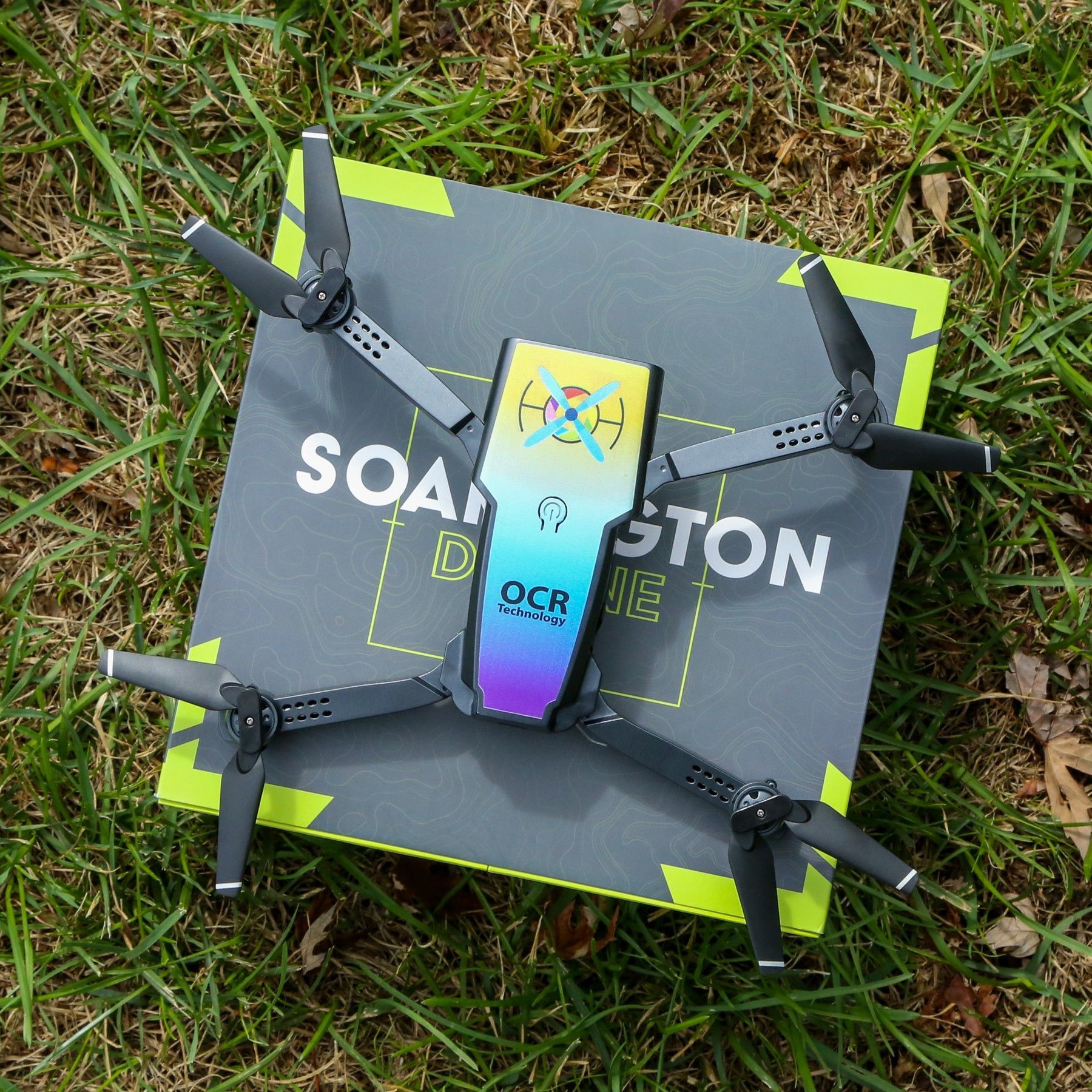 A drone is sitting on top of a box that says soaington