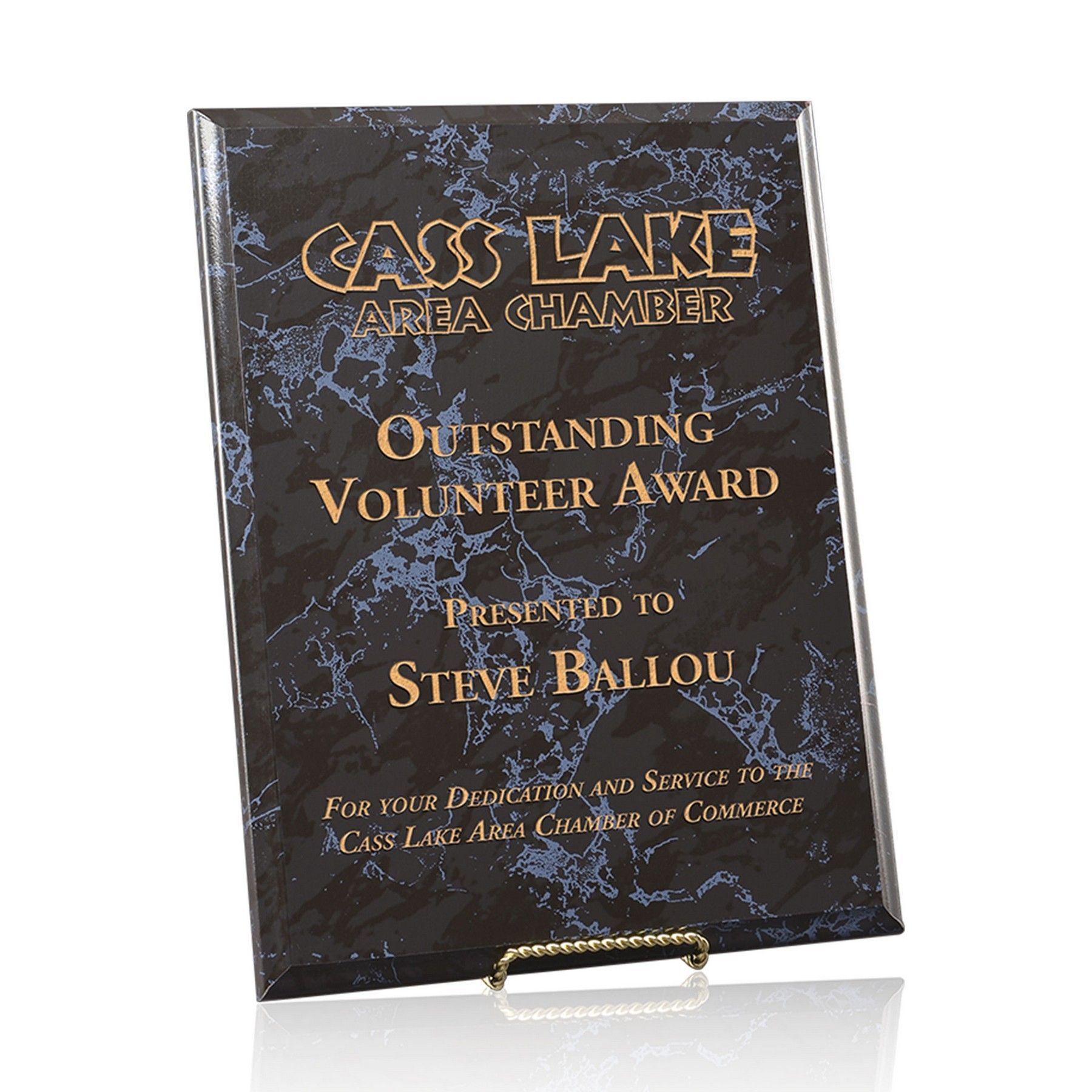 A plaque that says outstanding volunteer award presented to steve ballou