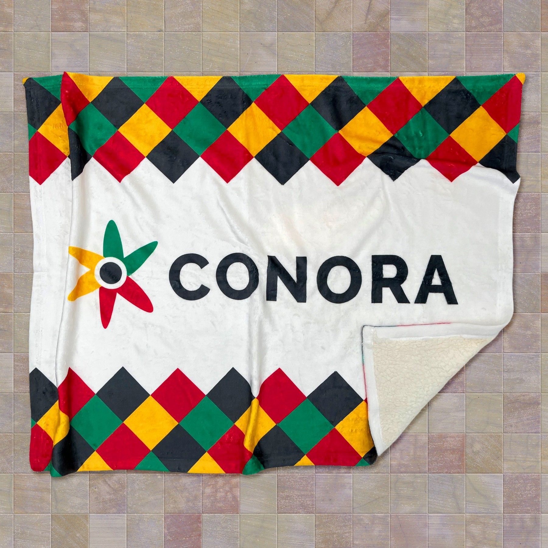 A blanket with the word conora on it