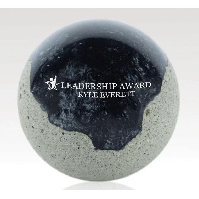 A leadership award for kyle everett sits on a table