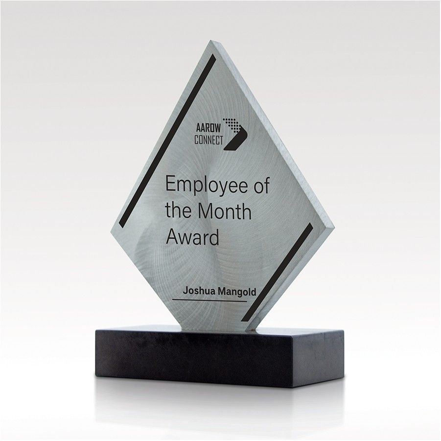 A diamond shaped plaque that says employee of the month award