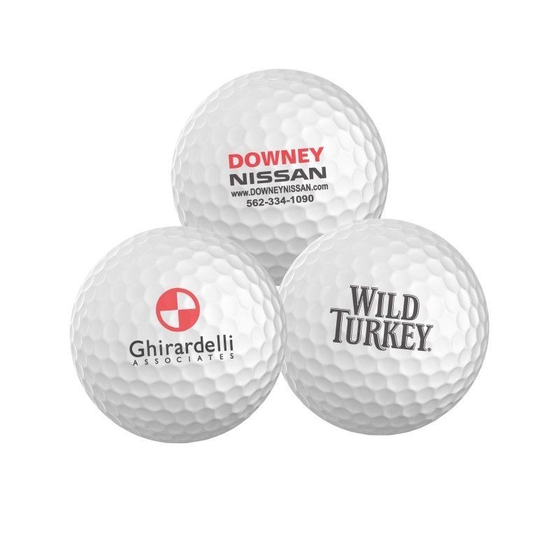 Three golf balls with one that says wild turkey on it