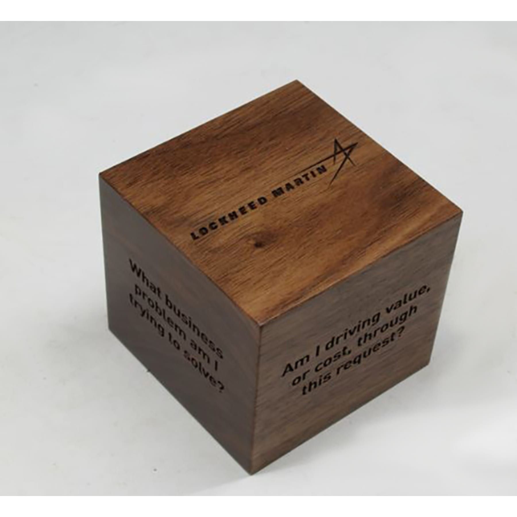 A wooden cube that says lookreed martin on it
