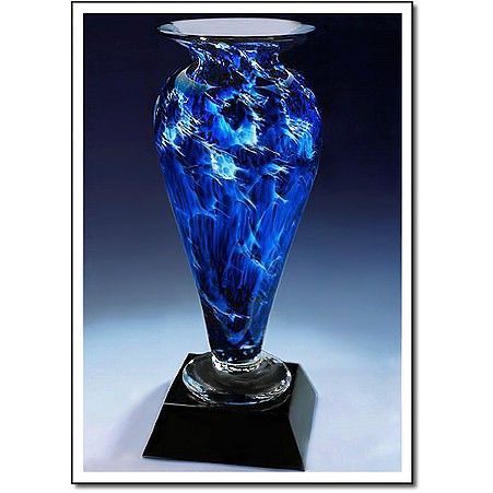 A blue vase is sitting on top of a black base.