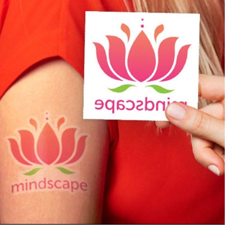 A woman is holding a sticker that says mindscape