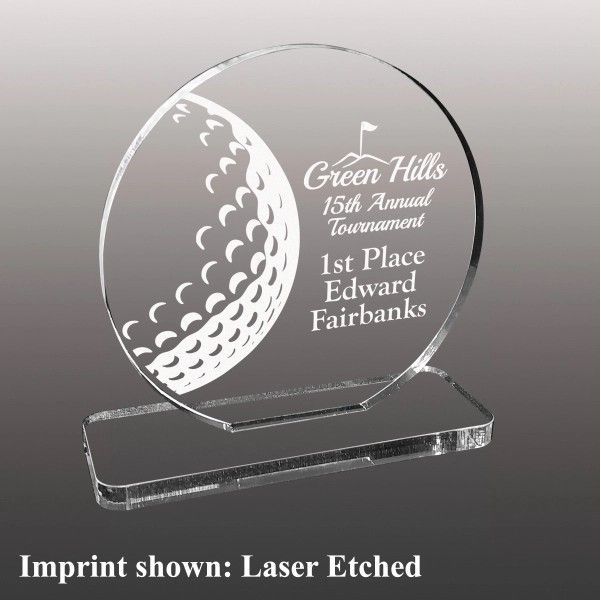 A clear acrylic plaque with a golf ball on it