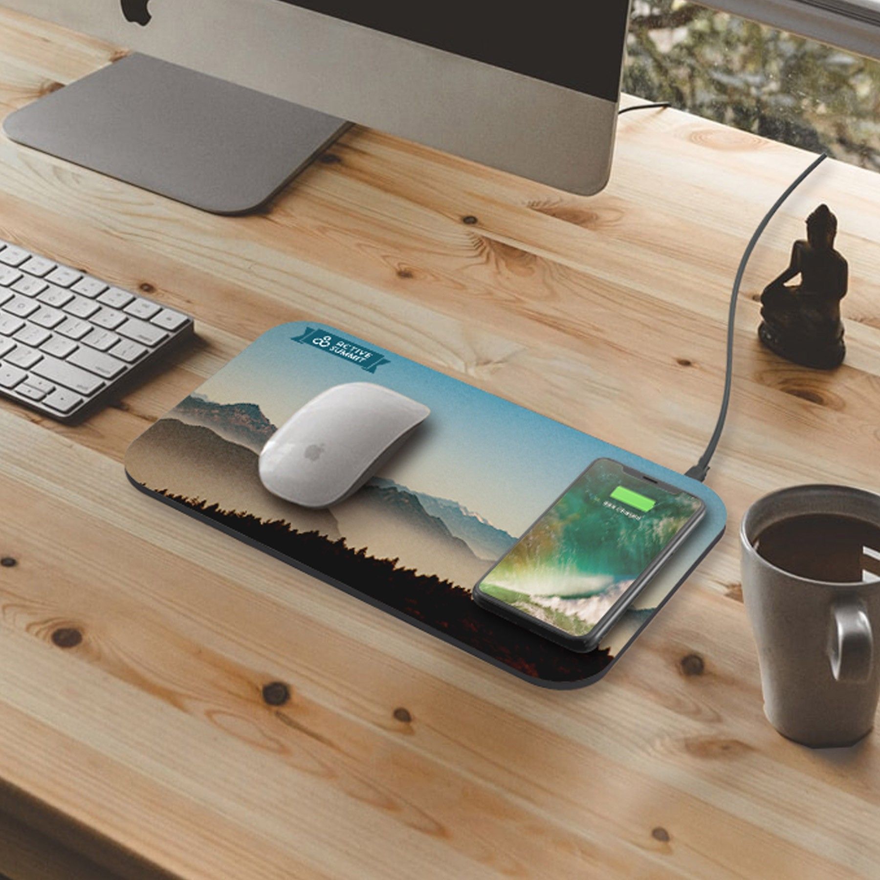 A mouse pad with a picture of mountains on it