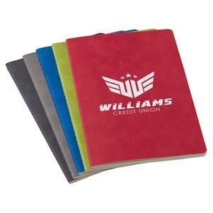 A williams credit union notebook is stacked on top of each other.