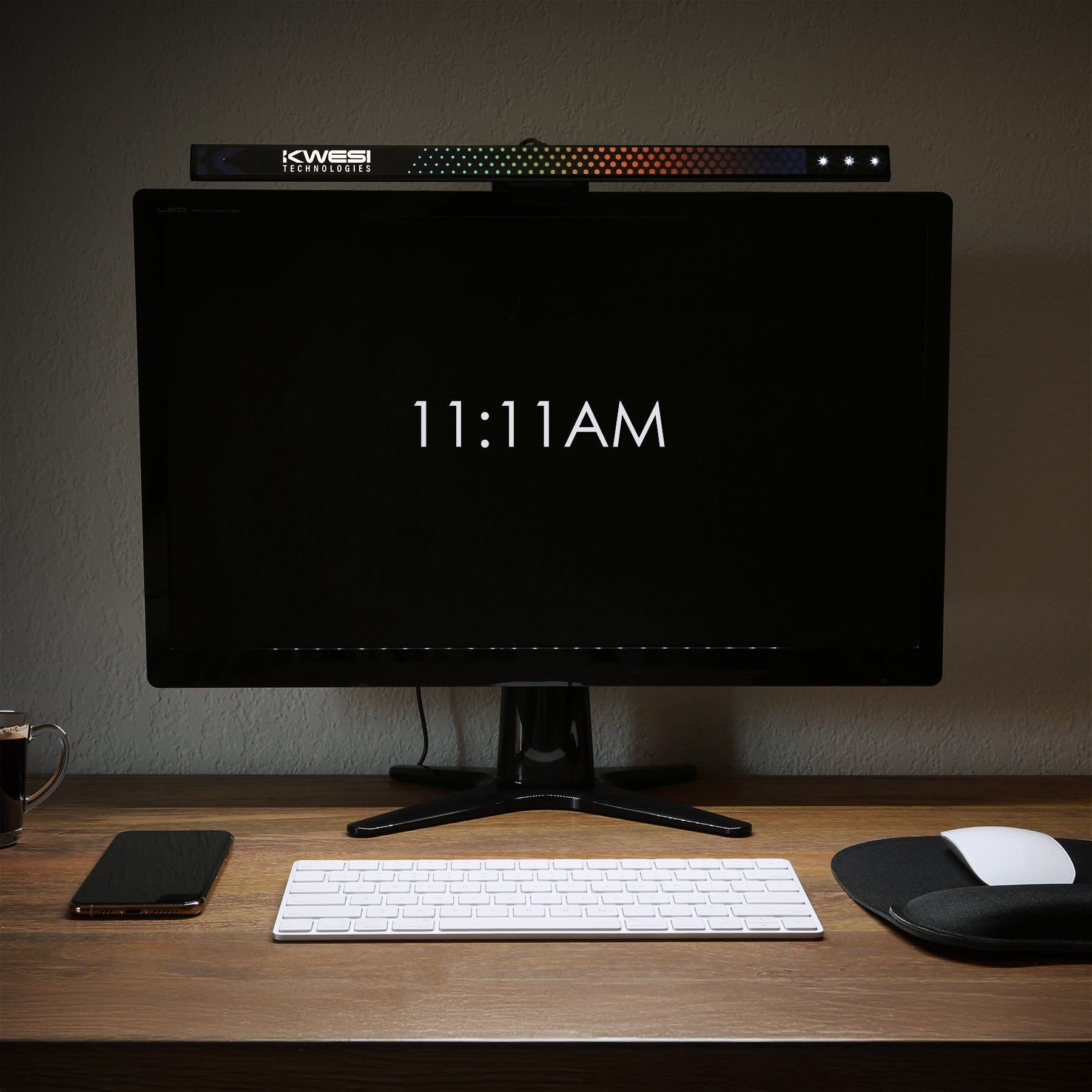 A computer monitor displays the time of 11:11 am