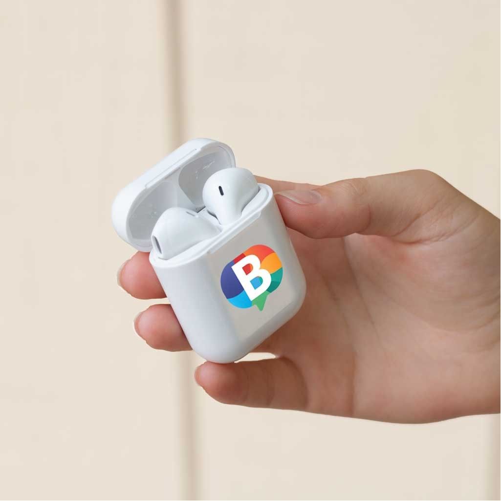 A person is holding a white case with the letter b on it