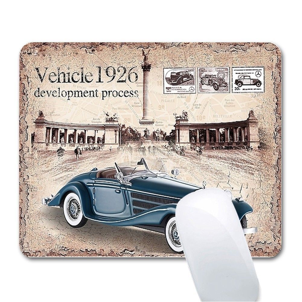 A mouse pad with a picture of a car on it.