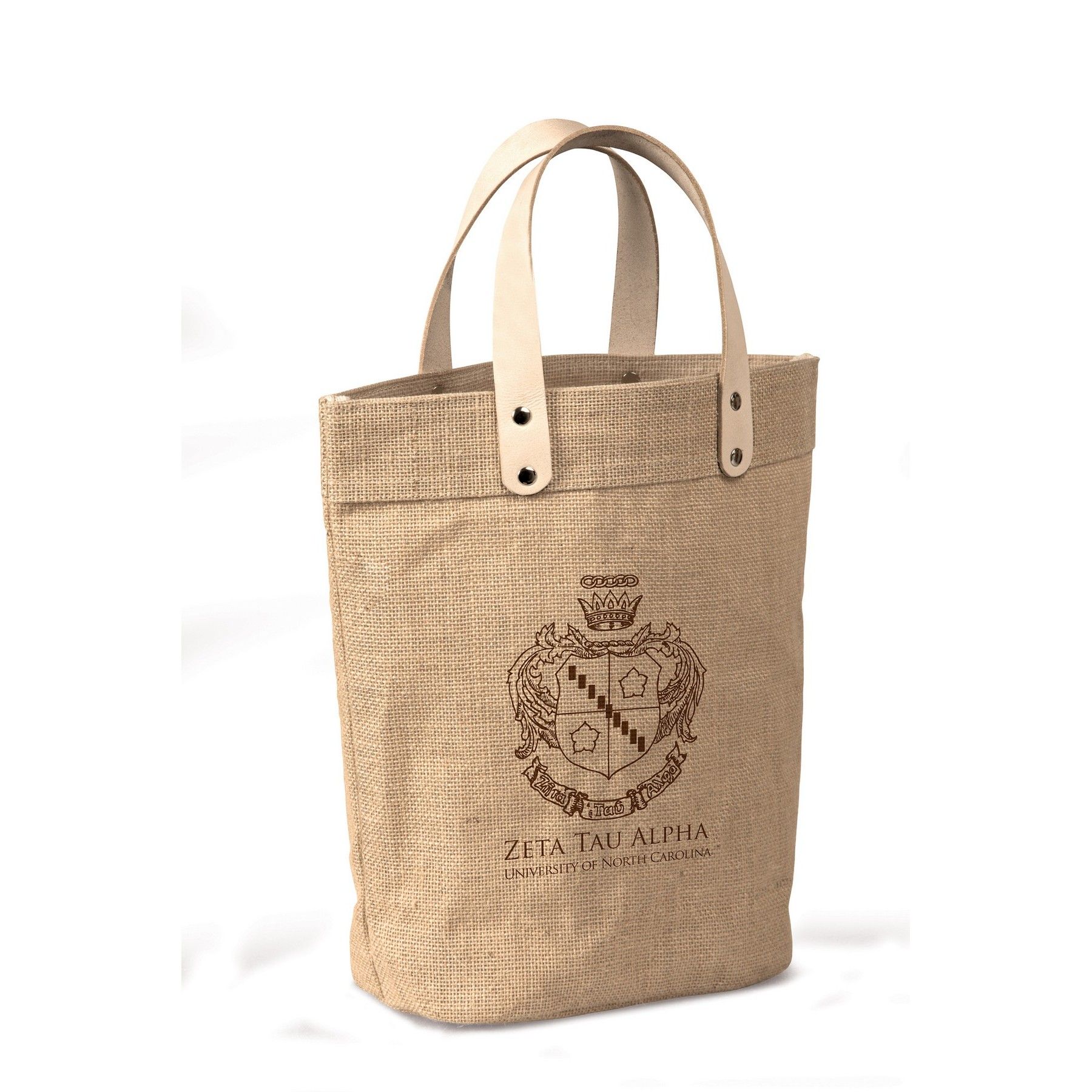 A jute tote bag with leather handles and a coat of arms on it