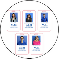 A group of people are standing next to each other in a circle.