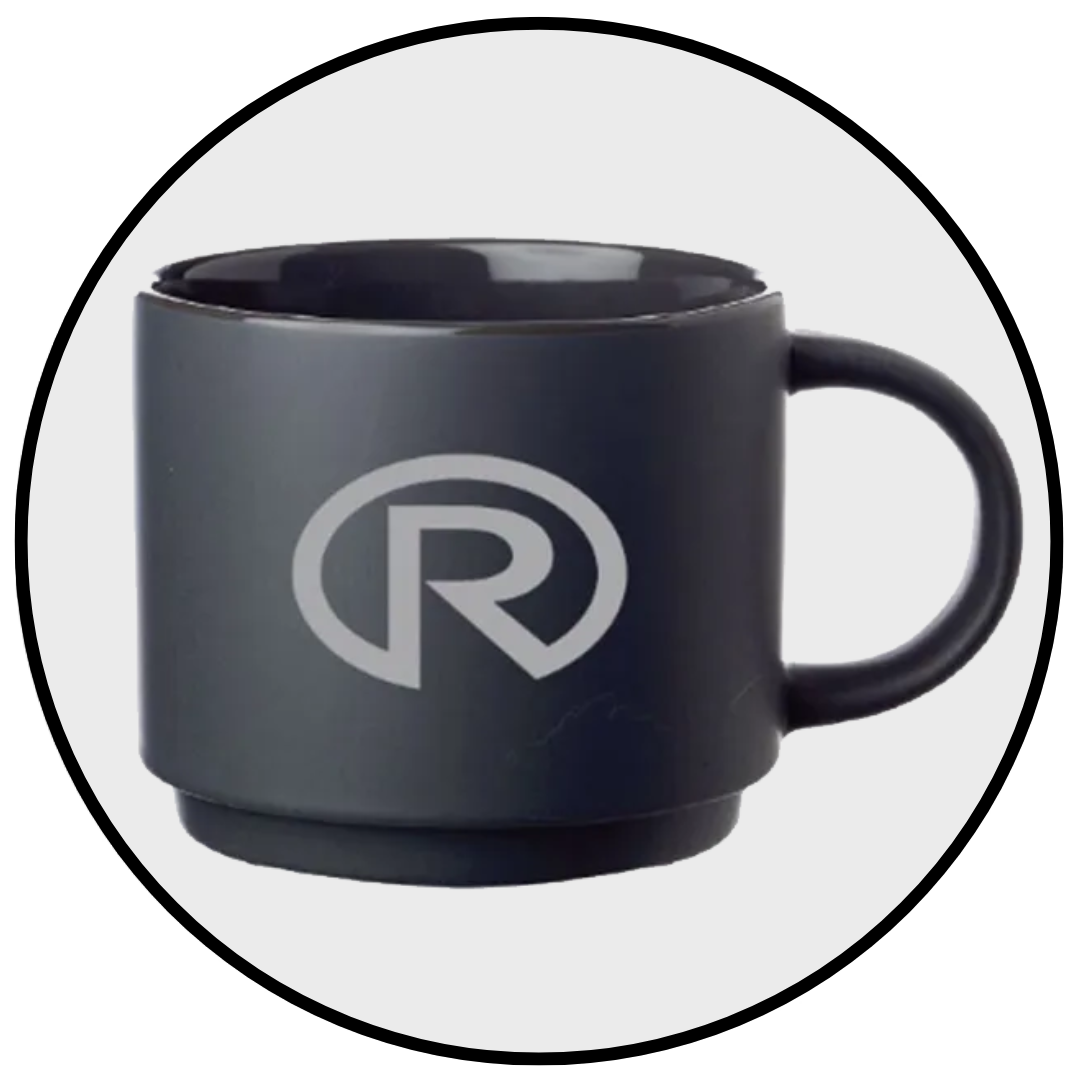 A black coffee mug with the letter r on it