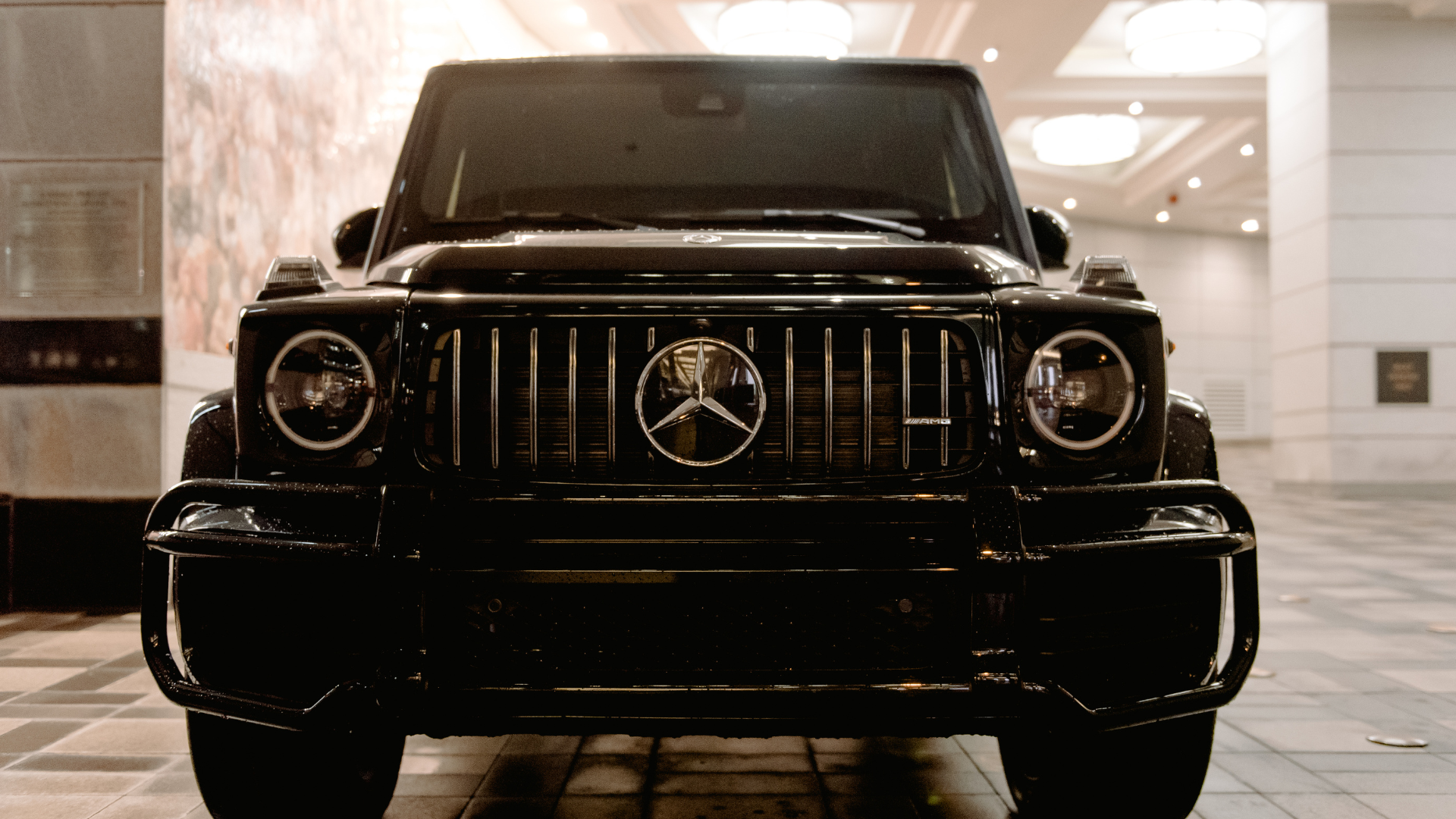 The inside of a bus with a lot of seats and stairs.