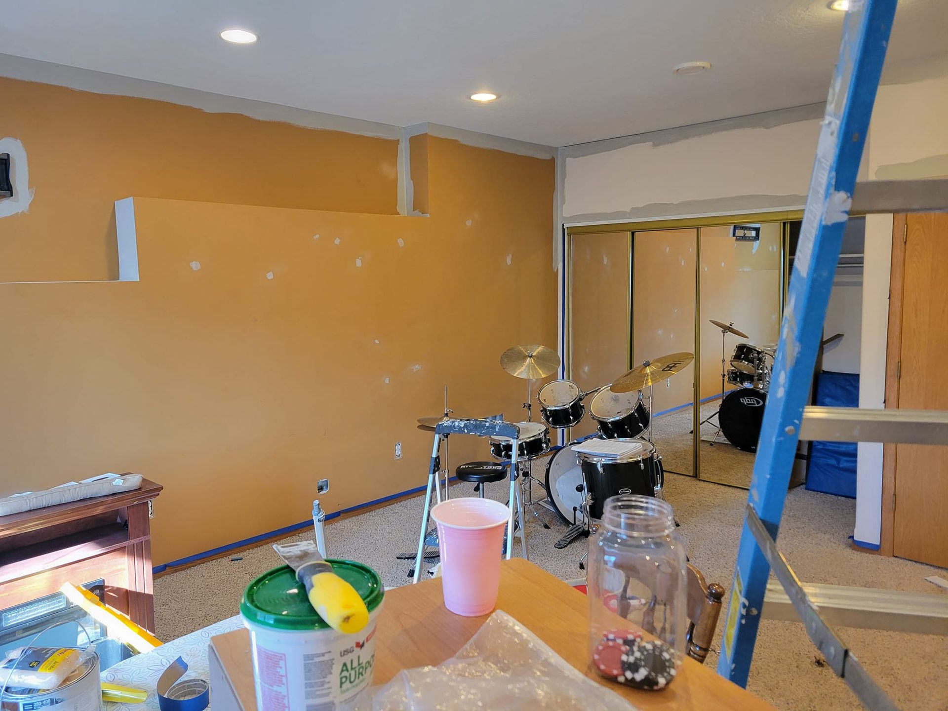 A Room With A Drum Set And A Ladder In It – Cottage Grove, MN - Minnesota Nice Painting