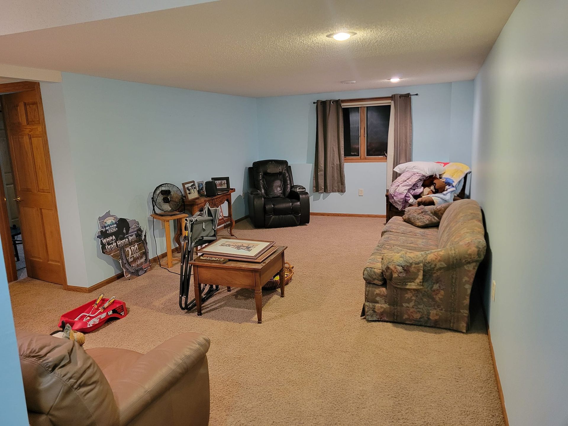 A Living Room With A Couch, Chair, Table, And Window – Cottage Grove, MN - Minnesota Nice Painting