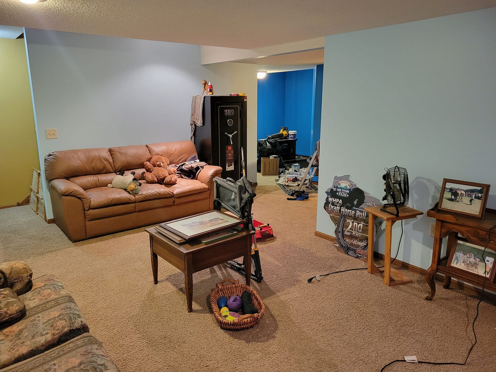 A Living Room With A Couch And A Table – Cottage Grove, MN - Minnesota Nice Painting