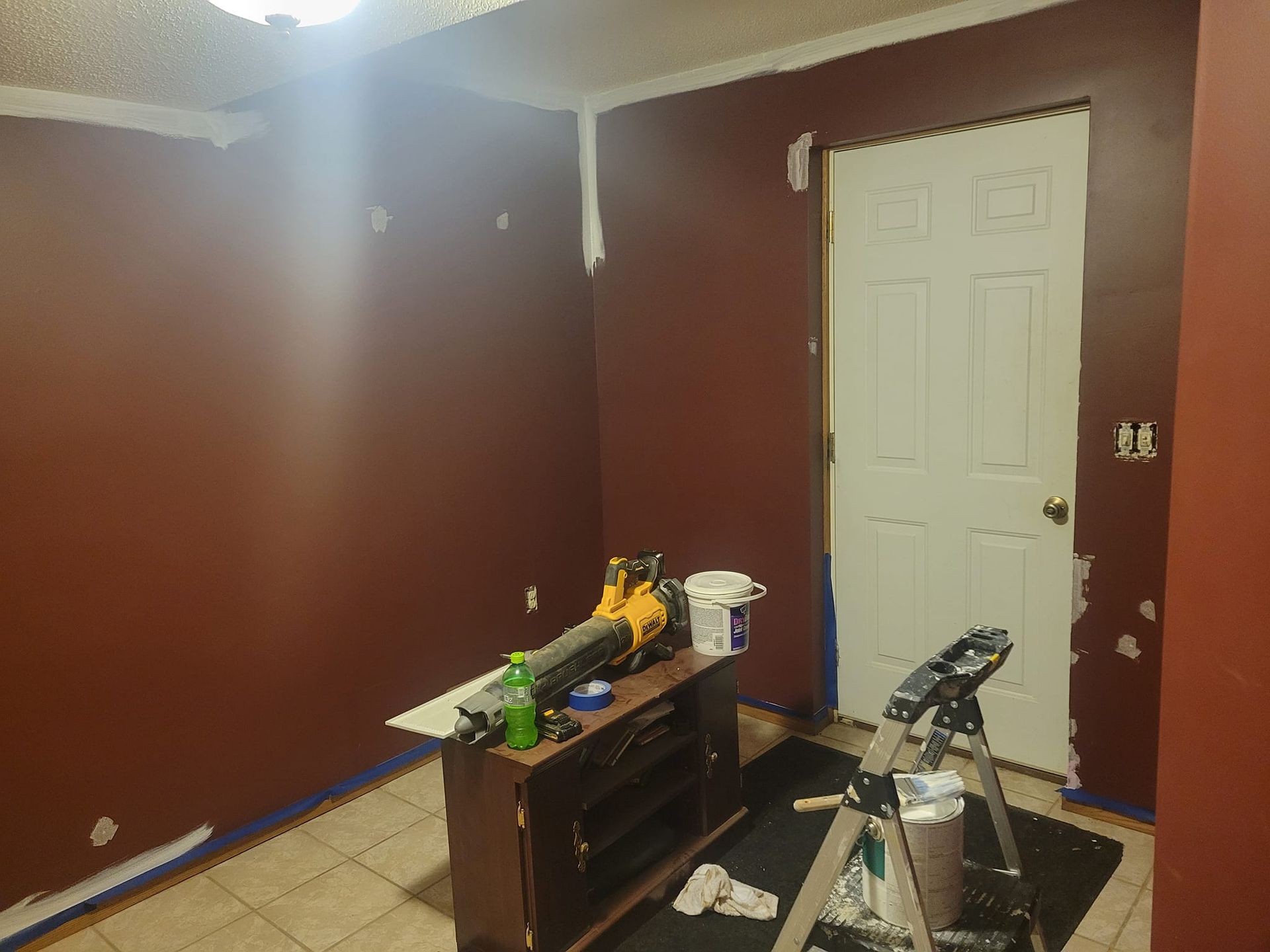 A Room With Red Walls And A White Door Is Being Painted – Cottage Grove, MN - Minnesota Nice Painting