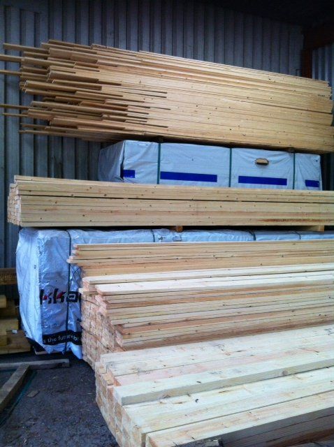 timber beams cut and stacked in warehouse
