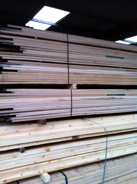 different lengths of timber stacked up and bound