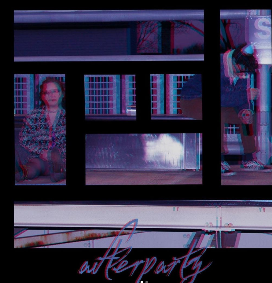 A woman is looking out of a window at a building.